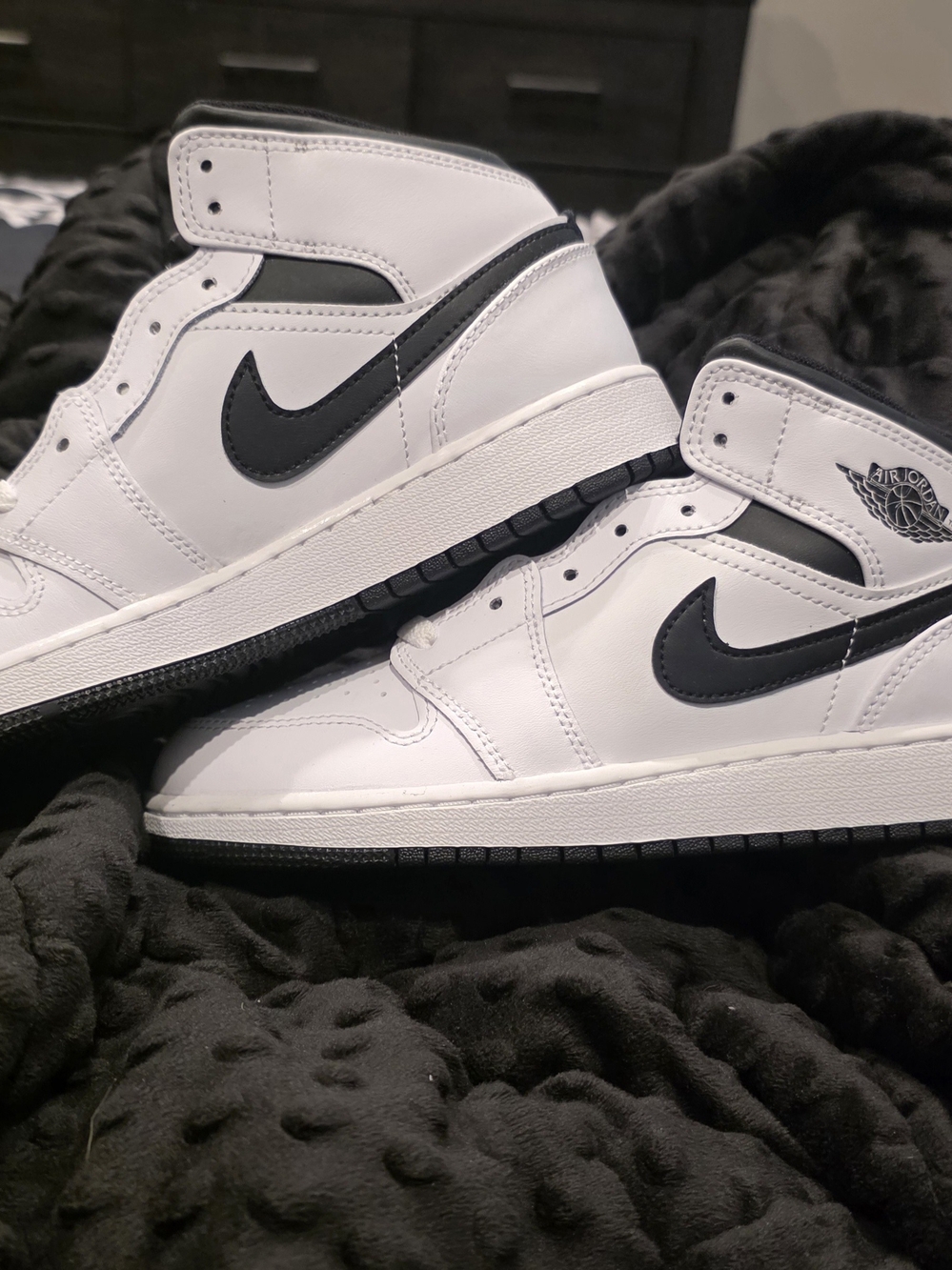 Nike Air Jordan 1 Mid sneakers in the "Reverse Panda" colorway,